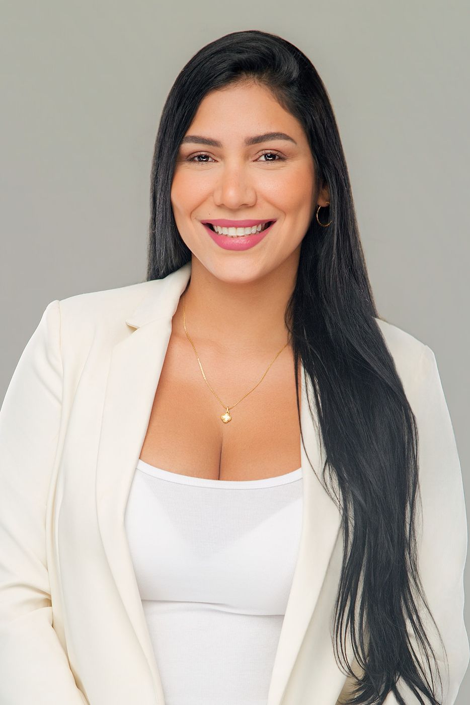 Studio portrait of a woman in a white blazer